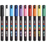 A collection of Posca water-based paint markers with fine tips, displayed in a row with various colors.